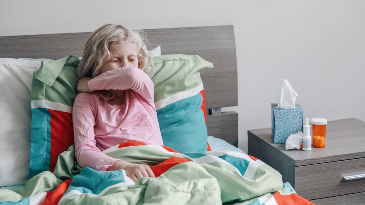 Photo of a child sick in bed