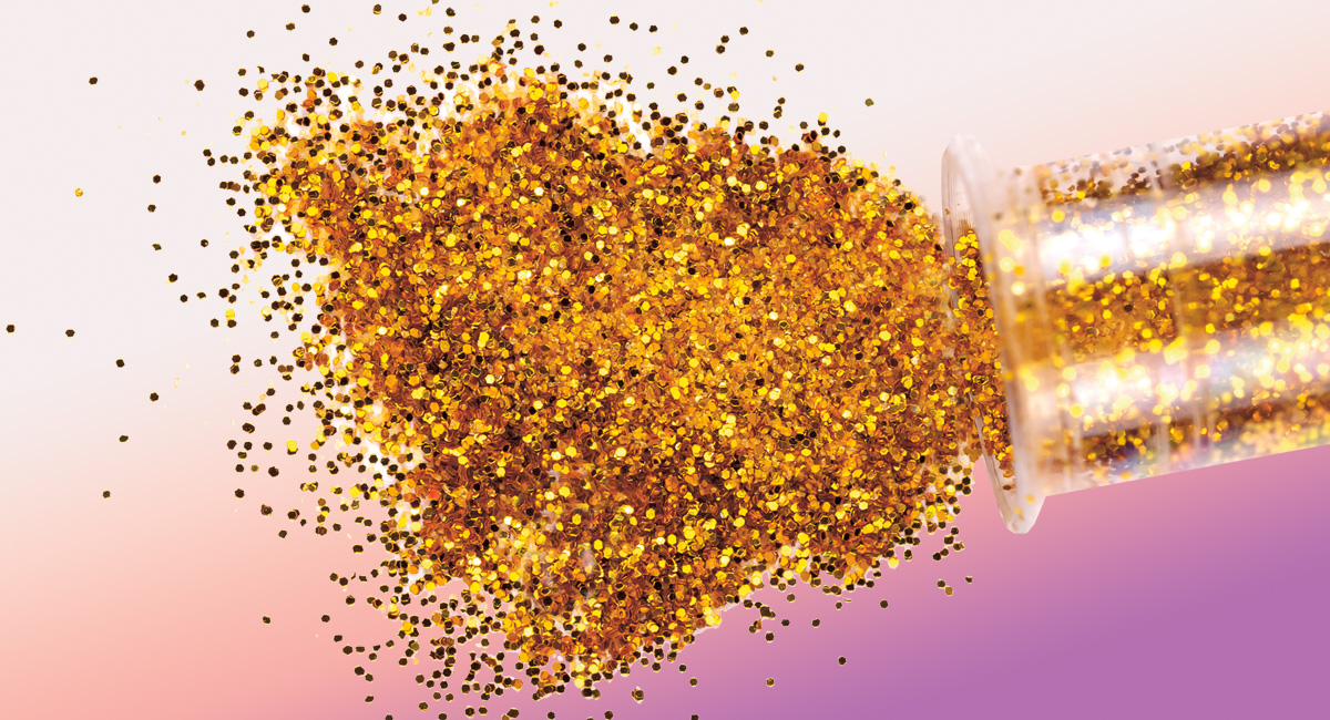 Image of gold glitter being emptied from a tube