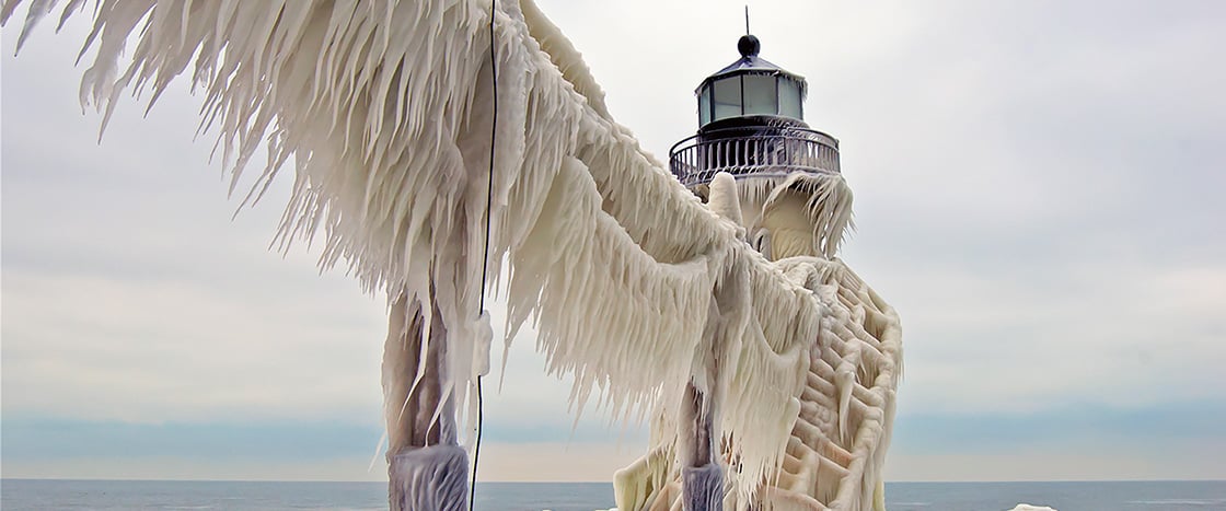 Image of a lighthouse layered with ice