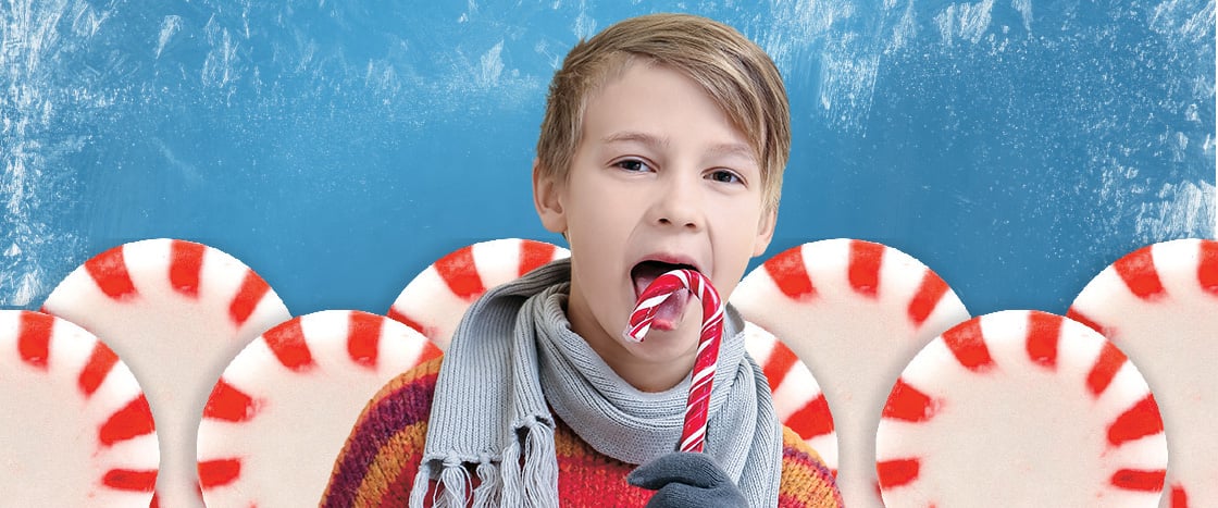 Image of kid surrounded by peppermint candy