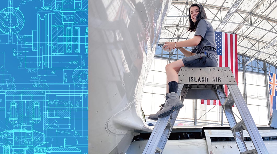 Image of airplane mechanic sitting on raised metal seat while working on plane