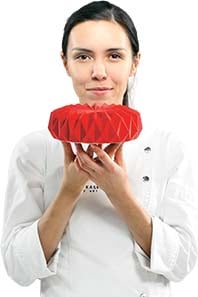Person holding a geometric cake