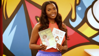 Person posing with two books