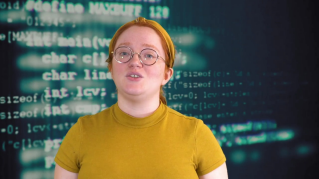 Photo of person standing in front of code